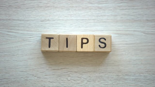 Tips word made of wooden cubes, informative presentations, blogging instructions