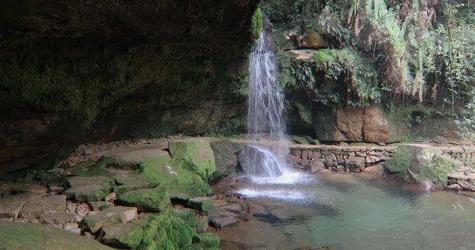 View of waterfall from a cave in the Garden of Caves, Sohra, Cherrapunji, Meghalaya, India.