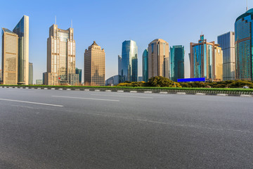 City skyscrapers and road asphalt pavement