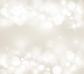 Blurred light beige background, bokeh, white circles, festive, glitter, light