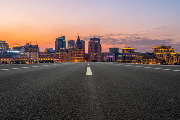 City skyscrapers and road asphalt pavement