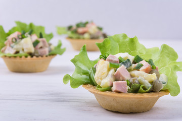 Traditional russian salad Olivier in tartlet