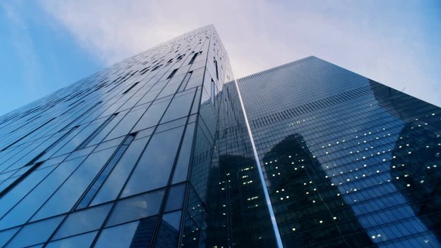 Reflective glassy walls of several skyscrapers. 6K Cinema camera footage.