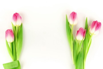 Flowers background. bouquet of pink tulips on a white background. top view. copy space. Holiday concept.