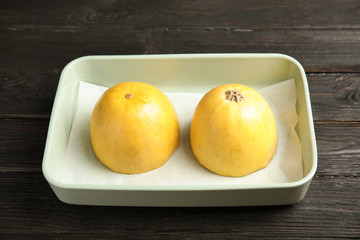 Raw cut spaghetti squash in baking dish on table