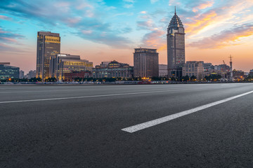 Obraz premium City skyscrapers and road asphalt pavement