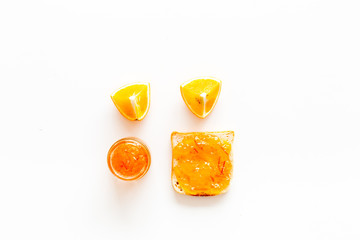 Sweet breakfast. Toast with orange jam on white background top view space for text