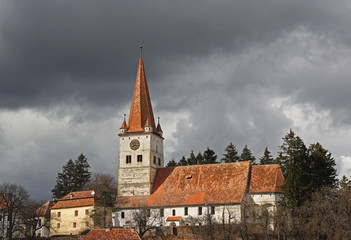 Fototapeta premium Cincu fortress under the dark clouds