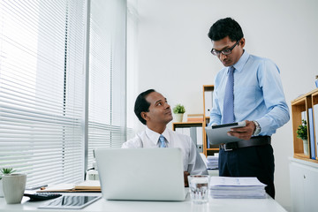 Colleagues discussing work