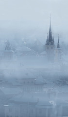 Church tower shrouded in mist