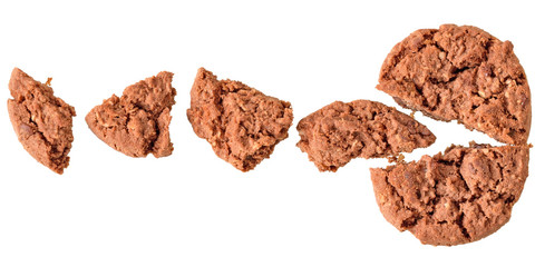 Pieces of crumbly cookies with cereals and chocolate top view isolated