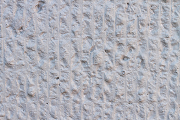 Wavy texture of white concrete convex wall