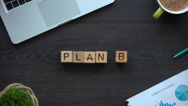 Plan B, business woman making word of cubes, fallback option, way out of crisis