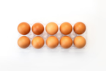 Chicken eggs in plastic package on white background.