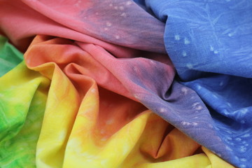Rainbow Coloured Tie Dyed Fabric Background with Soft Focus