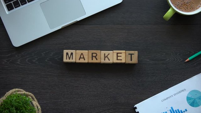 Market word made of cubes, stock chart, growth and decrease of investments