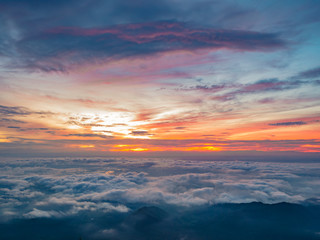 Beautiful Sunrise Sky with Sea of the mist of fog in the morning on Khao Luang mountain in Ramkhamhaeng National Park,Sukhothai province Thailand