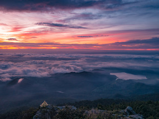 Beautiful Sunrise Sky with Sea of the mist of fog and heart shaped lake in the morning on Khao Luang mountain in Ramkhamhaeng National Park,Sukhothai province Thailand