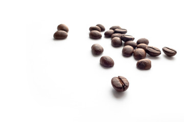 Roasted coffee beans on white background.