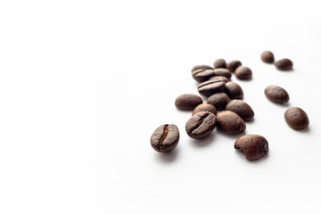 Roasted coffee beans on white background.