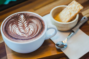 Hot cocoa filling fresh milk and bread in a cafe in the morning