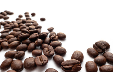 Roasted coffee beans on white background.