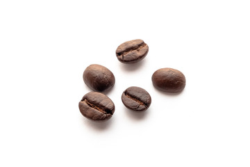 Roasted coffee beans on white background.