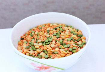  plate with peas and lentils on white background
