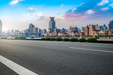 Naklejka premium City skyscrapers and road asphalt pavement
