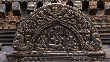 Wood carvings of Hindu Gods on the temple in Bhaktapur Durbar Square