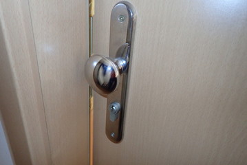 metail door handle on a modern door