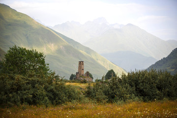 Old dilapidated watchtower in the village of SNO, Georgia. Mountain valley of a small authentic...