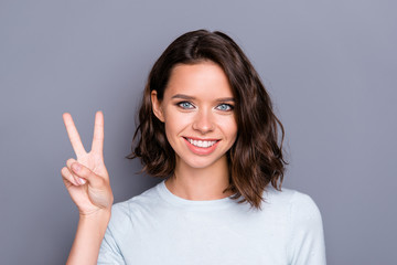Close up portrait of friendly dreamy lady with her brunette curl
