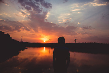 Young man looking at the sunset