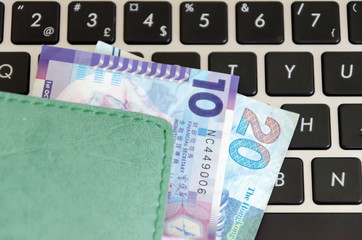 Banknotes on a black keyboard