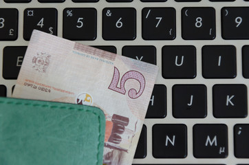 Banknotes on a black keyboard