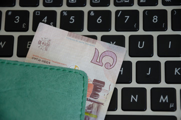 Banknotes on a black keyboard