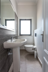 Obraz na płótnie Canvas Modern bathroom shower room with toilet and amenities.