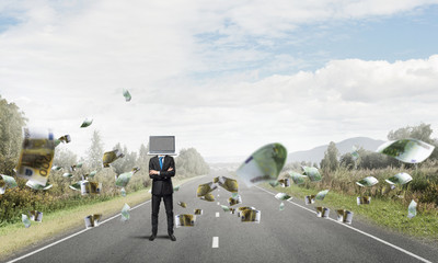 Businessman with laptop instead of head.