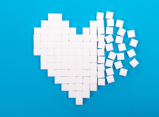 Fototapeta premium Broken heart made of sugar cubes