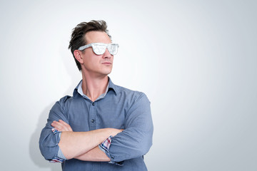 Confident man in shirt and aluminum glasses, visionary concept