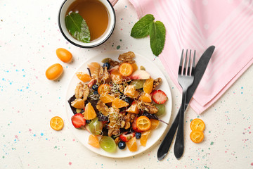 Delicious fresh salad with walnuts on plate