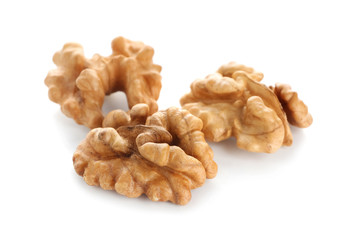 Shelled walnuts on white background