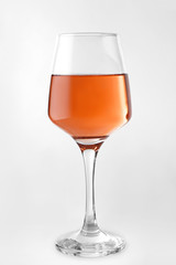 Glass of tasty wine on white background