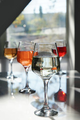 Glasses of tasty wine on table