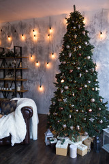 Christmas tree with garland and toys close-up. New Year.