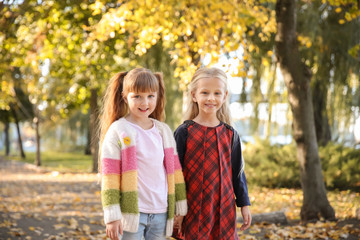 Fototapeta premium Cute little girls in autumn park