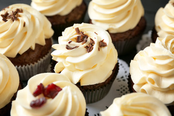 Tasty chocolate cupcakes on table, closeup