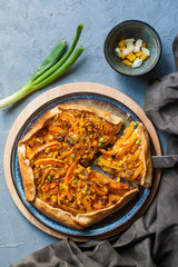Homemade galeta with pumpkin, bell pepper, corn and green onion.
