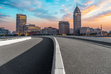 Naklejka premium City skyscrapers and road asphalt pavement